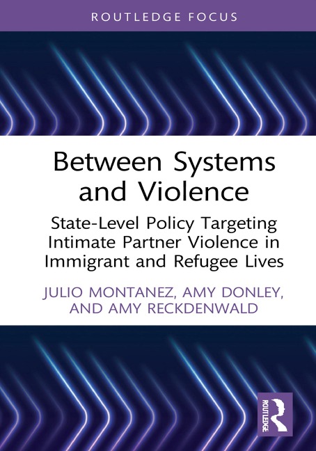 Between Systems and Violence - Julio Montanez, Amy Reckdenwald, Amy Donley