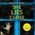 Cover-Bild zum Titel 'She Lies Close Lib/E' von 'Sharon Doering'