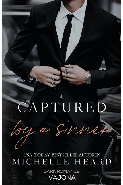 Captured by a Sinner - Michelle Heard